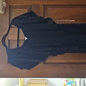 Fancy black Cache jump suit with tags.